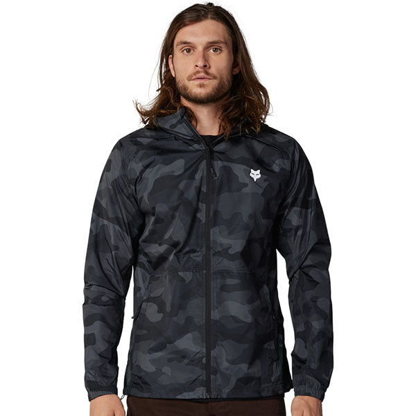 Front view of Fox Racing Fox Head Camo Windbreaker in Black Camo, SKU 33690-247, featuring lightweight packable design and DWR coating
