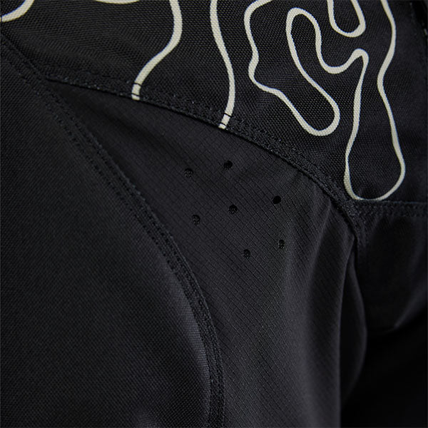 Action pose with Black Hello Future Pants (SKU: 33542-001), showing flexibility and movement