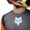 Close-up of collar and shoulder seam on Fox Racing Flexair Grid Jersey in Black and Orange (SKU: 33539-016)