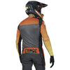 Rear view of Fox Racing Flexair Grid Jersey in Black and Orange (SKU: 33539-016), featuring drop-tail hem and fade graphics