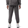 Side view of model wearing Wordmark Joggers in Pewter, SKU 33146-052, highlighting fleece material and embroidery
