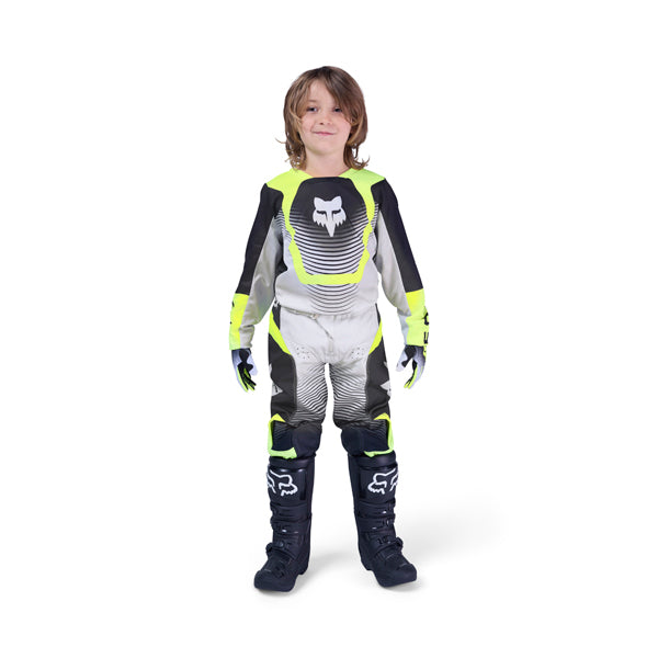 Front view of Fox Racing 180 women's jersey and pants in charcoal and orange, modeled for motocross