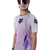 Fox Racing Ranger Foundry Jersey (MTB) (Womens) in Lavender Drift, modeled front three-quarter view, with the crew neck, long sleeves, contrasting shoulder and arm graphics, and extended rear hem on a rider. Available options—Color: Lavender Drift; Size: XS, SM, MD, LG, XL. SKU 40168-F07-M. UPC 198571115411.