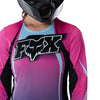 Fox Racing Flexair SE TS57 Long Sleeve Jersey (MTB) (Womens) in Pink, modeled front three-quarter view, with the crew neck, long sleeves, contrasting shoulder and arm graphics, and extended rear hem on a rider. Available options—Color: Pink; Size: XS, SM, MD, LG, XL. SKU 40169-170-M. UPC 198571135006.