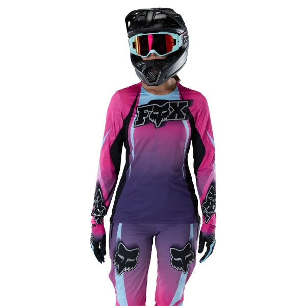 Fox Racing Flexair SE TS57 Long Sleeve Jersey (MTB) (Womens) in Pink, close-up of the lower hem and drop-tail panel, with the printed Fox artwork, mesh-knit texture, reinforced seam lines, and shaped cuff or hem. Available options—Color: Pink; Size: XS, SM, MD, LG, XL.