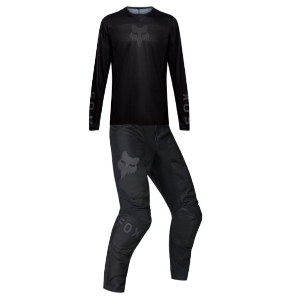 Fox Racing 180 Blackout Jersey, Pant Combo in Black, studio layout of the jersey and matching riding pants, with the long-sleeve jersey above coordinated pants, matching Fox graphics, articulated knees, and contrasting leg panels. Available option—Color: Black.