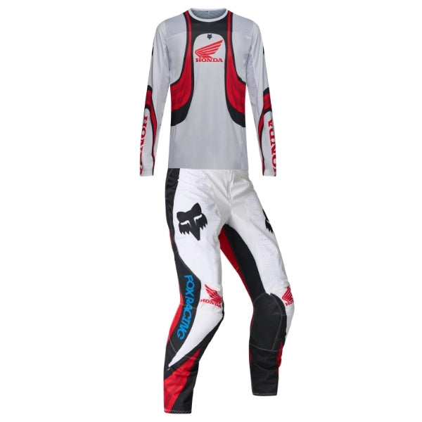 Fox Racing 180 Honda Jersey, Pant Combo, studio layout of the jersey and matching riding pants, with the long-sleeve jersey above coordinated pants, matching Fox graphics, articulated knees, and contrasting leg panels.