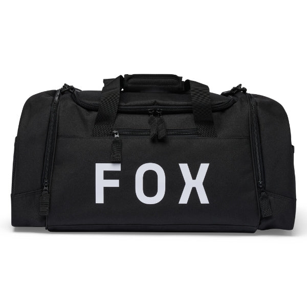 Fox Racing 180 Duffle in Black, long-side view, with the main zippered compartment, reinforced base, carry handles, end pocket, wheels, and large Fox logo. Available options—Color: Black, Vivid Green, Orange. SKU 39035-001-OS. UPC 198571122501.