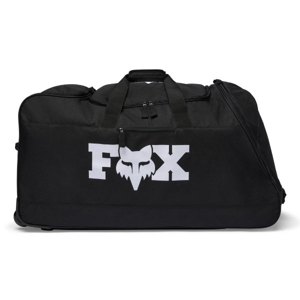 Fox Racing 180 Roller Bag in Black, long-side view, with the main zippered compartment, reinforced base, carry handles, end pocket, wheels, and large Fox logo. Available options—Color: Black, Pewter, Midnight. SKU 40540-001-OS. UPC 198571122518.