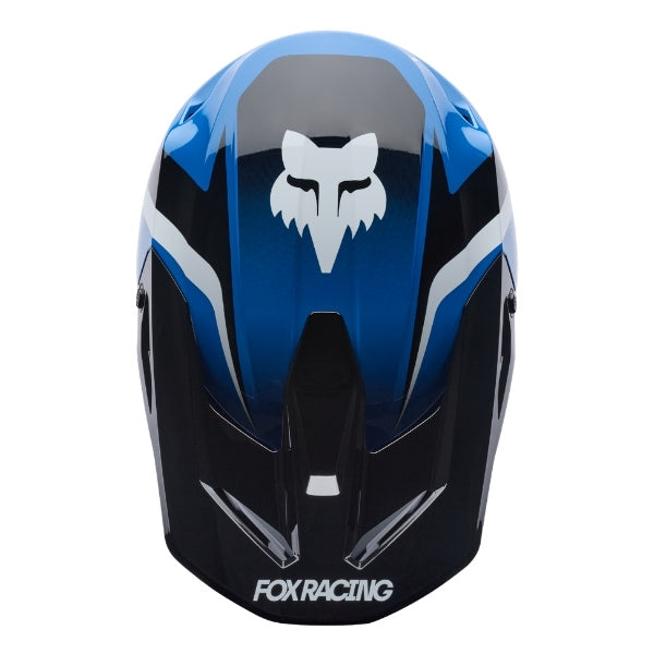 Fox Racing V1 Frame Helmet in Blue, top view, with the visor tip, crown vents, shell graphics, and central Fox logo. Available options—Color: Black, Blue, Grey/Yellow, Neon Pink, Red; Size: XS, SM, MD, LG, XL, 2X. SKU 40615-002-XL. UPC 198571123874.