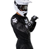 Fox Racing 180 BNKR Jersey in Black Camo, close-up of the chest and shoulder panels, with the printed Fox artwork, mesh-knit texture, reinforced seam lines, and shaped cuff or hem. Available options—Color: Black Camo; Size: XS, SM, MD, LG, XL, 2X. SKU 40649-247-L. UPC 198571123331.