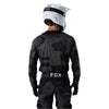 Fox Racing 180 BNKR Jersey in Black Camo, close-up of the lower hem and drop-tail panel, with the printed Fox artwork, mesh-knit texture, reinforced seam lines, and shaped cuff or hem. Available options—Color: Black Camo; Size: XS, SM, MD, LG, XL, 2X. SKU 40649-247-2X. UPC 198571123355.