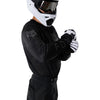 Fox Racing 180 Blackout Jersey in Black, close-up of the chest and shoulder panels, with the printed Fox artwork, mesh-knit texture, reinforced seam lines, and shaped cuff or hem. Available options—Color: Black; Size: XS, SM, MD, LG, XL, 2X, 3X. SKU 40650-001-L. UPC 198571122853.
