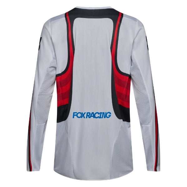 Fox Racing 180 Honda Jersey in White/Red, rear product view, with the back graphic, shoulder panels, long sleeves, and drop-tail hem. Available options—Color: White/Red; Size: XS, SM, MD, LG, XL, 2X. SKU 40652-077-S. UPC 198571132722.
