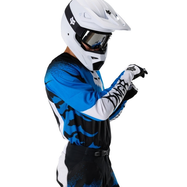 Fox Racing 180 HD38 Jersey in Black/Blue, close-up of the chest and shoulder panels, with the printed Fox artwork, mesh-knit texture, reinforced seam lines, and shaped cuff or hem. Available options—Color: Black/Blue; Size: XS, SM, MD, LG, XL, 2X. SKU 40653-013-L. UPC 198571135198.