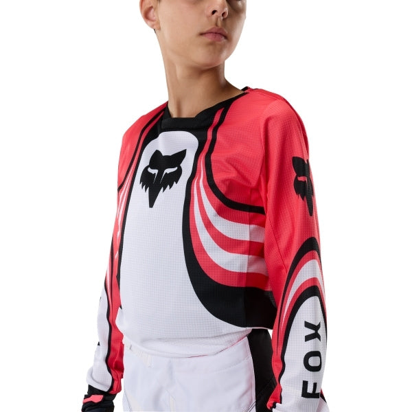 Fox Racing 180 Draft Jersey (Youth) in White, modeled front three-quarter view, with the crew neck, long sleeves, contrasting shoulder and arm graphics, and extended rear hem on a rider. Available options—Color: White, Sunburst; Size: Y-SM, Y-MD, Y-LG, Y-XL. SKU 40654-008-YL. UPC 198571132227.