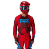 Fox Racing 180 Raid Jersey in Rust, close-up of the sleeve graphic and cuff, with the printed Fox artwork, mesh-knit texture, reinforced seam lines, and shaped cuff or hem. Available options—Color: Rust, Purple Lava, Deep Fern; Size: XS, SM, MD, LG, XL, 2X. SKU 40655-180-XL. UPC 198571130872.