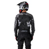 Fox Racing 180 Abyss Jersey in Black, close-up of the lower hem and drop-tail panel, with the printed Fox artwork, mesh-knit texture, reinforced seam lines, and shaped cuff or hem. Available options—Color: Black; Size: XS, SM, MD, LG, XL, 2X. SKU 40656-001-2X. UPC 198571122310.