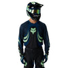 Fox Racing 180 Draft Jersey in Black, close-up of the sleeve graphic and cuff, with the printed Fox artwork, mesh-knit texture, reinforced seam lines, and shaped cuff or hem. Available options—Color: White, Black, Sunburst; Size: XS, SM, MD, LG, XL, 2X. SKU 40657-001-XL. UPC 198571122693.