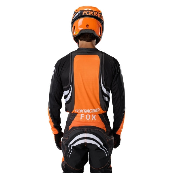 Fox Racing 180 Draft Jersey in Sunburst, close-up of the lower hem and drop-tail panel, with the printed Fox artwork, mesh-knit texture, reinforced seam lines, and shaped cuff or hem. Available options—Color: White, Black, Sunburst; Size: XS, SM, MD, LG, XL, 2X. SKU 40657-460-2X. UPC 198571131619.