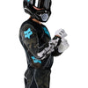 Fox Racing Flexair Apex Jersey in Black, close-up of the chest and shoulder panels, with the printed Fox artwork, mesh-knit texture, reinforced seam lines, and shaped cuff or hem. Available options—Color: Black; Size: SM, MD, LG, XL, 2X. SKU 40660-001-XL. UPC 198571133552.