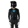 Fox Racing Flexair Apex Jersey in Black, close-up of the sleeve graphic and cuff, with the printed Fox artwork, mesh-knit texture, reinforced seam lines, and shaped cuff or hem. Available options—Color: Black; Size: SM, MD, LG, XL, 2X. SKU 40660-001-2X. UPC 198571133569.