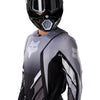 Fox Racing 360 Foundry Jersey in Black/Grey, modeled front three-quarter view, with the crew neck, long sleeves, contrasting shoulder and arm graphics, and extended rear hem on a rider. Available options—Color: Black/Grey, Flo Red, Sky Blue, HiViz Yellow; Size: SM, MD, LG, XL, 2X. SKU 40664-014-L. UPC 198571123423.