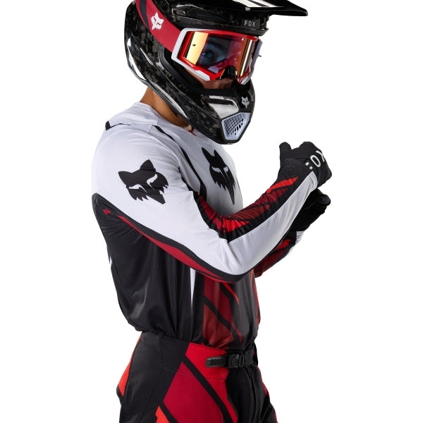Fox Racing 360 Foundry Jersey in Flo Red, close-up of the sleeve graphic and cuff, with the printed Fox artwork, mesh-knit texture, reinforced seam lines, and shaped cuff or hem. Available options—Color: Black/Grey, Flo Red, Sky Blue, HiViz Yellow; Size: SM, MD, LG, XL, 2X. SKU 40664-110-2X. UPC 198571125502.