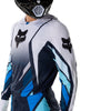 Fox Racing 360 Foundry Jersey in Sky Blue, close-up of the sleeve graphic and cuff, with the printed Fox artwork, mesh-knit texture, reinforced seam lines, and shaped cuff or hem. Available options—Color: Black/Grey, Flo Red, Sky Blue, HiViz Yellow; Size: SM, MD, LG, XL, 2X. SKU 40664-D67-2X. UPC 198571131275.