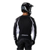 Fox Racing 180 Frame Jersey in Black, close-up of the lower hem and drop-tail panel, with the printed Fox artwork, mesh-knit texture, reinforced seam lines, and shaped cuff or hem. Available options—Color: Blue, Grey/Yellow, Black, Red; Size: XS, SM, MD, LG, XL, 2X, 3X. SKU 40665-001-2X. UPC 198571122242.