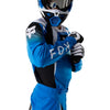 Fox Racing 180 Frame Jersey in Blue, close-up of the chest and shoulder panels, with the printed Fox artwork, mesh-knit texture, reinforced seam lines, and shaped cuff or hem. Available options—Color: Blue, Grey/Yellow, Black, Red; Size: XS, SM, MD, LG, XL, 2X, 3X. SKU 40665-002-L. UPC 198571124024.