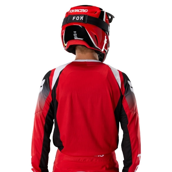 Fox Racing 180 Frame Jersey in Red, close-up of the sleeve graphic and cuff, with the printed Fox artwork, mesh-knit texture, reinforced seam lines, and shaped cuff or hem. Available options—Color: Blue, Grey/Yellow, Black, Red; Size: XS, SM, MD, LG, XL, 2X, 3X. SKU 40665-003-XL. UPC 198571129876.