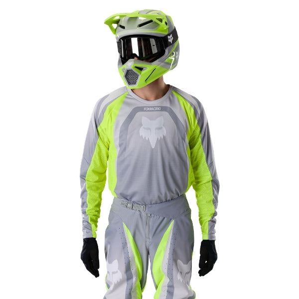 Fox Racing 180 Frame Jersey in Grey/Yellow, close-up of the sleeve graphic and cuff, with the printed Fox artwork, mesh-knit texture, reinforced seam lines, and shaped cuff or hem. Available options—Color: Blue, Grey/Yellow, Black, Red; Size: XS, SM, MD, LG, XL, 2X, 3X. SKU 40665-086-XL. UPC 198571126097.