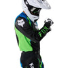 Fox Racing 180 Kawasaki Jersey in Black, close-up of the chest and shoulder panels, with the printed Fox artwork, mesh-knit texture, reinforced seam lines, and shaped cuff or hem. Available options—Color: Black; Size: XS, SM, MD, LG, XL, 2X. SKU 40667-001-L. UPC 198571121832.