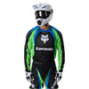 Fox Racing 180 Kawasaki Jersey in Black, close-up of the sleeve graphic and cuff, with the printed Fox artwork, mesh-knit texture, reinforced seam lines, and shaped cuff or hem. Available options—Color: Black; Size: XS, SM, MD, LG, XL, 2X. SKU 40667-001-XL. UPC 198571121849.