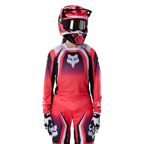 Fox Racing 180 Frame Jersey (Womens) in Neon Pink, close-up of the sleeve graphic and cuff, with the printed Fox artwork, mesh-knit texture, reinforced seam lines, and shaped cuff or hem. Available options—Color: Neon Pink, Deep Blue; Size: XS, SM, MD, LG, XL. SKU 40668-065-XL. UPC 198571128138.