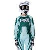 Fox Racing 180 Raid Jersey (Womens) in Melon, close-up of the lower hem and drop-tail panel, with the printed Fox artwork, mesh-knit texture, reinforced seam lines, and shaped cuff or hem. Available options—Color: Lavender Drift, Melon; Size: XS, SM, MD, LG, XL.