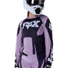 Fox Racing 180 Raid Jersey (Womens) in Lavender Drift, modeled front three-quarter view, with the crew neck, long sleeves, contrasting shoulder and arm graphics, and extended rear hem on a rider. Available options—Color: Lavender Drift, Melon; Size: XS, SM, MD, LG, XL. SKU 40669-F07-M. UPC 198571126806.