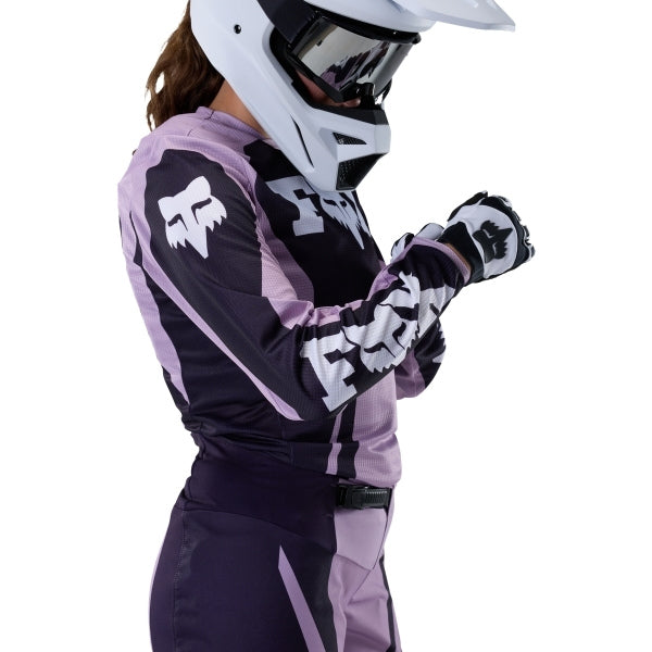 Fox Racing 180 Raid Jersey (Womens) in Lavender Drift, close-up of the chest and shoulder panels, with the printed Fox artwork, mesh-knit texture, reinforced seam lines, and shaped cuff or hem. Available options—Color: Lavender Drift, Melon; Size: XS, SM, MD, LG, XL. SKU 40669-F07-L. UPC 198571126813.