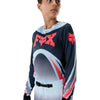 Fox Racing Flexair Arc Jersey (Youth) in Ice Blue, modeled front three-quarter view, with the crew neck, long sleeves, contrasting shoulder and arm graphics, and extended rear hem on a rider. Available options—Color: Ice Blue, Chili; Size: Y-SM, Y-MD, Y-LG, Y-XL. SKU 40671-231-YL. UPC 198571126578.