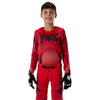 Fox Racing Flexair Arc Jersey (Youth) in Chili, full modeled front view, with the crew neck, long sleeves, contrasting shoulder and arm graphics, and extended rear hem on a rider. Available options—Color: Ice Blue, Chili; Size: Y-SM, Y-MD, Y-LG, Y-XL.