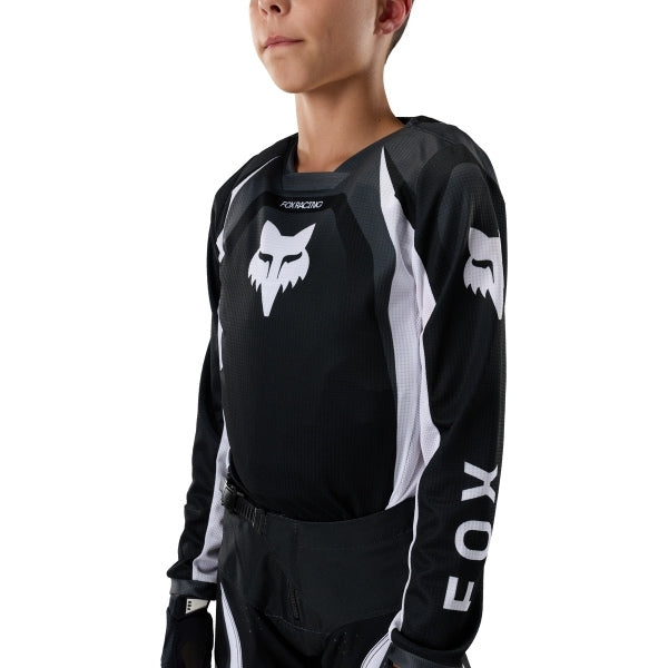Fox Racing 180 Frame Jersey (Youth) in Red, front product view, with the crew neck, long sleeves, large Fox chest graphic, contrasting arm panels, and curved drop-tail hem. Available options—Color: Blue, Grey/Yellow, Black, Red; Size: Y-SM, Y-MD, Y-LG, Y-XL. SKU 40672-003-YS. UPC 198571129982.