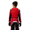 Fox Racing 180 Frame Jersey (Youth) in Red, full modeled rear view, with the back graphic, shoulder panels, long sleeves, and drop-tail hem. Available options—Color: Blue, Grey/Yellow, Black, Red; Size: Y-SM, Y-MD, Y-LG, Y-XL.