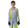 Fox Racing 180 Frame Jersey (Youth) in Black, front product view, with the crew neck, long sleeves, large Fox chest graphic, contrasting arm panels, and curved drop-tail hem. Available options—Color: Blue, Grey/Yellow, Black, Red; Size: Y-SM, Y-MD, Y-LG, Y-XL. SKU 40672-001-YS. UPC 198571122617.