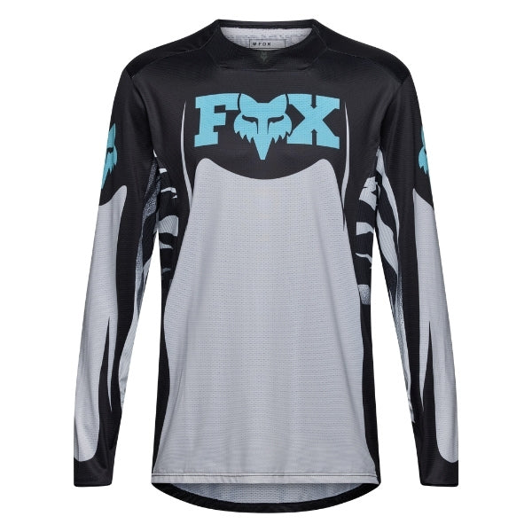 Fox Racing 360 Clutch Jersey in White/Black, front product view, with the crew neck, long sleeves, large Fox chest graphic, contrasting arm panels, and curved drop-tail hem. Available options—Color: White/Black, Neon Pink; Size: SM, MD, LG, XL, 2X. SKU 40678-058-S. UPC 198571132494.