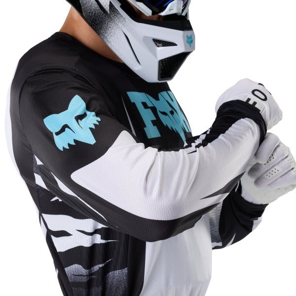Fox Racing 360 Clutch Jersey in White/Black, close-up of the chest and shoulder panels, with the printed Fox artwork, mesh-knit texture, reinforced seam lines, and shaped cuff or hem. Available options—Color: White/Black, Neon Pink; Size: SM, MD, LG, XL, 2X. SKU 40678-058-XL. UPC 198571132524.