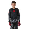 Fox Racing 180 Abyss Jersey (Youth) in Black, close-up of the sleeve graphic and cuff, with the printed Fox artwork, mesh-knit texture, reinforced seam lines, and shaped cuff or hem. Available options—Color: Black; Size: Y-SM, Y-MD, Y-LG, Y-XL.