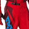 Fox Racing 180 Raid Pants in Rust, close-up of the waist and hip panels, with the ratcheting waist adjuster, stretch yoke, shaped hip panel, and reinforced knee or thigh material. Available options—Color: Rust, Purple Lava, Deep Fern; Size: 28, 30, 32, 34, 36, 38. SKU 40685-180-32. UPC 198571130919.