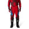 Fox Racing 180 Raid Pants in Rust, close-up of the side thigh and knee panels, with the ratcheting waist adjuster, stretch yoke, shaped hip panel, and reinforced knee or thigh material. Available options—Color: Rust, Purple Lava, Deep Fern; Size: 28, 30, 32, 34, 36, 38. SKU 40685-180-36. UPC 198571130933.