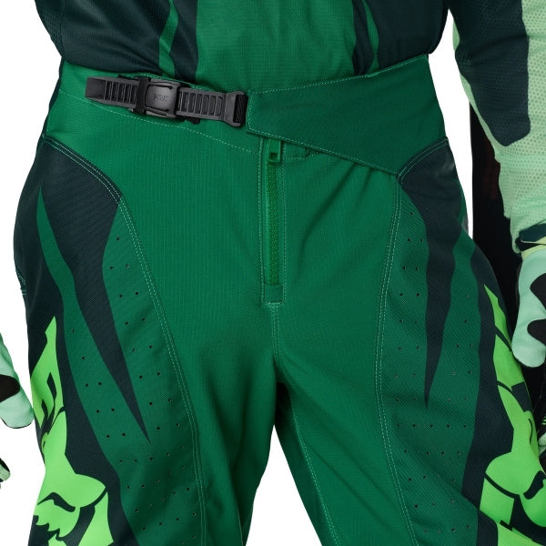 Fox Racing 180 Raid Pants in Deep Fern, close-up of the waist and hip panels, with the ratcheting waist adjuster, stretch yoke, shaped hip panel, and reinforced knee or thigh material. Available options—Color: Rust, Purple Lava, Deep Fern; Size: 28, 30, 32, 34, 36, 38. SKU 40685-D10-32. UPC 198571125083.
